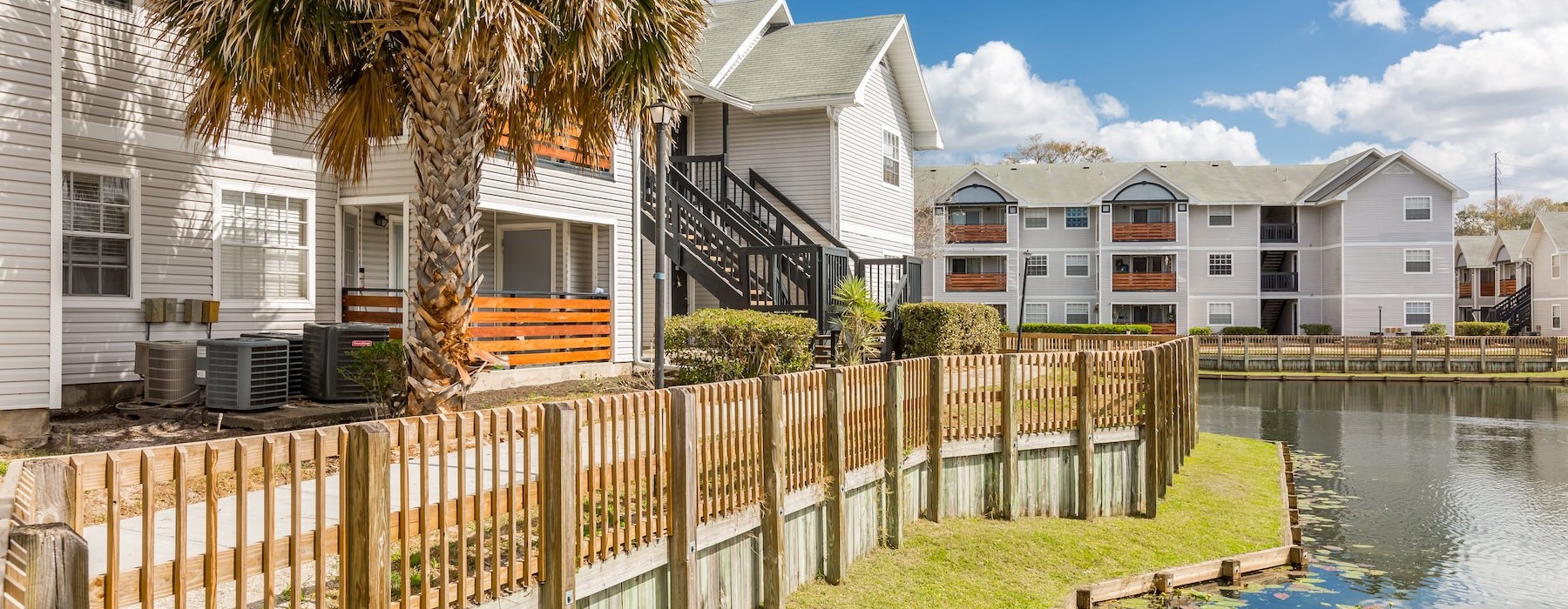 a row of houses next to a body of water